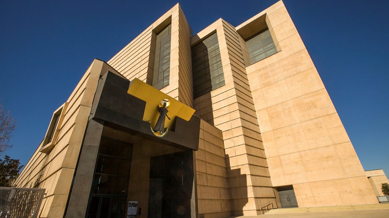 This Jan. 21, 2013 file photo shows the entrance to the Cathedral of Our Lady of the Angels, the headquarters for the Roman Catholic Archdiocese of Los Angeles. (AP Photo/Damian Dovarganes, File)