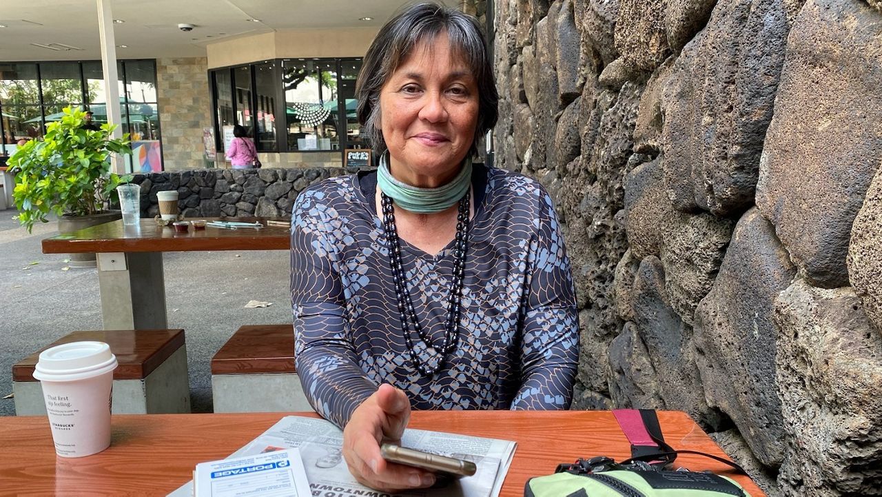 Catherine Cruz takes a break from reporting on March 24, 2023, to talk with Spectrum News Hawaii. (Michelle Broder Van Dyke/Spectrum News)