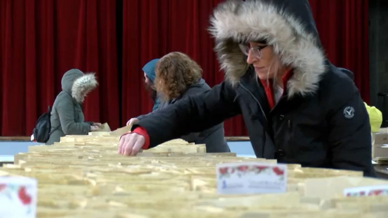 Volunteers prepare meals for Christmas Bishop's Dinner