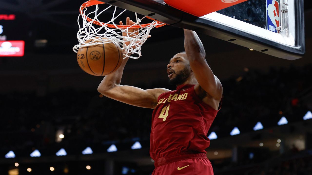 Cleveland Cavaliers forward Evan Mobley dunks against the Charlotte Hornets during the first half of an NBA basketball game, Monday, March 25, 2024, in Cleveland. (AP Photo/Ron Schwane)