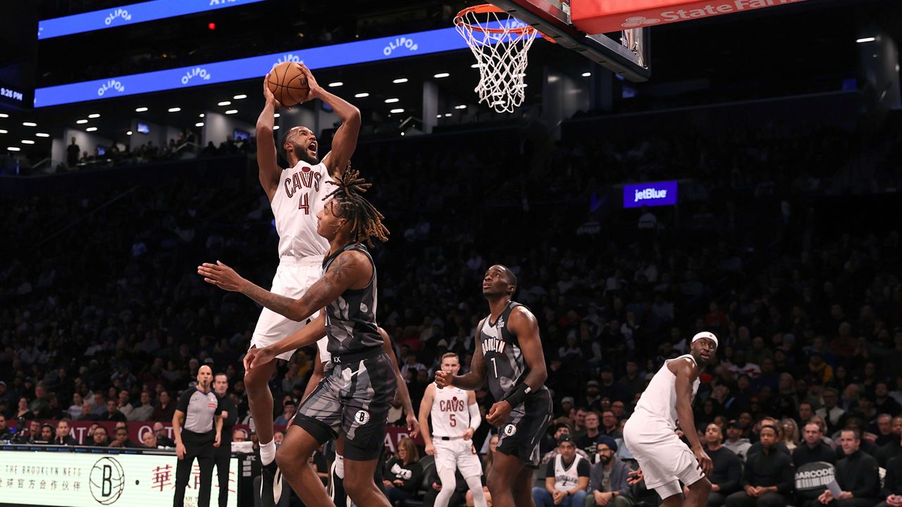 Cleveland Cavaliers' Evan Mobley (4) goes up to shoot during the second half of an NBA basketball game against the Brooklyn Nets, Monday, Dec. 16, 2024, in New York. (AP Photo/Pamela Smith)