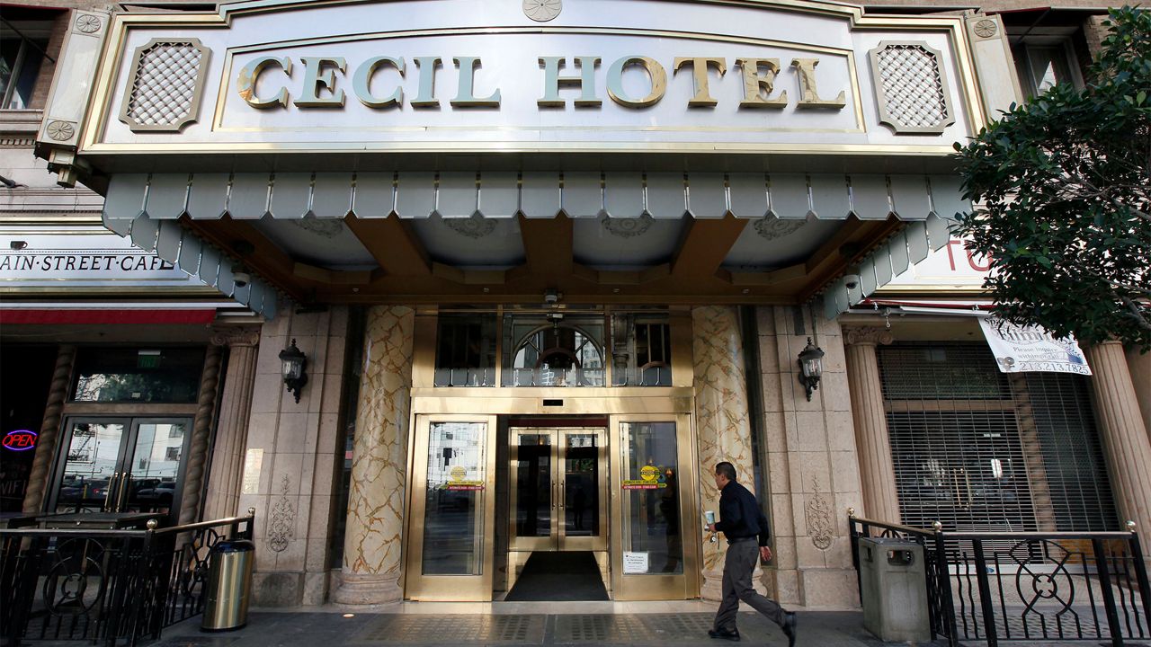 A visitor arrives at the Cecil Hotel on Feb. 20, 2013, where police say the body of a woman was found wedged in one of the water tanks on the roof was that of a missing Canadian guest. (AP Photo/Nick Ut)