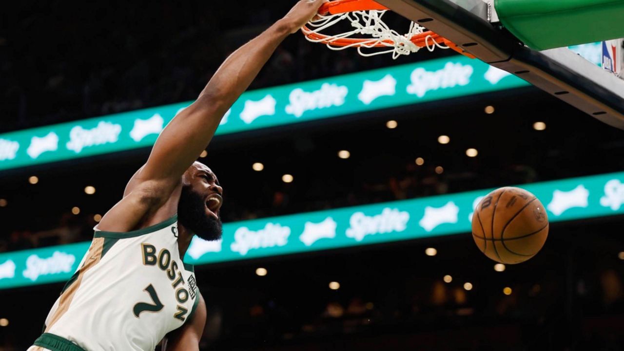 Boston Celtics' Jaylen Brown dunks during the second half of an NBA basketball game against the Toronto Raptors, Friday, Dec. 29, 2023, in Boston. The Celtics take on the Pacers Saturday. (Associated Press/Michael Dwyer)