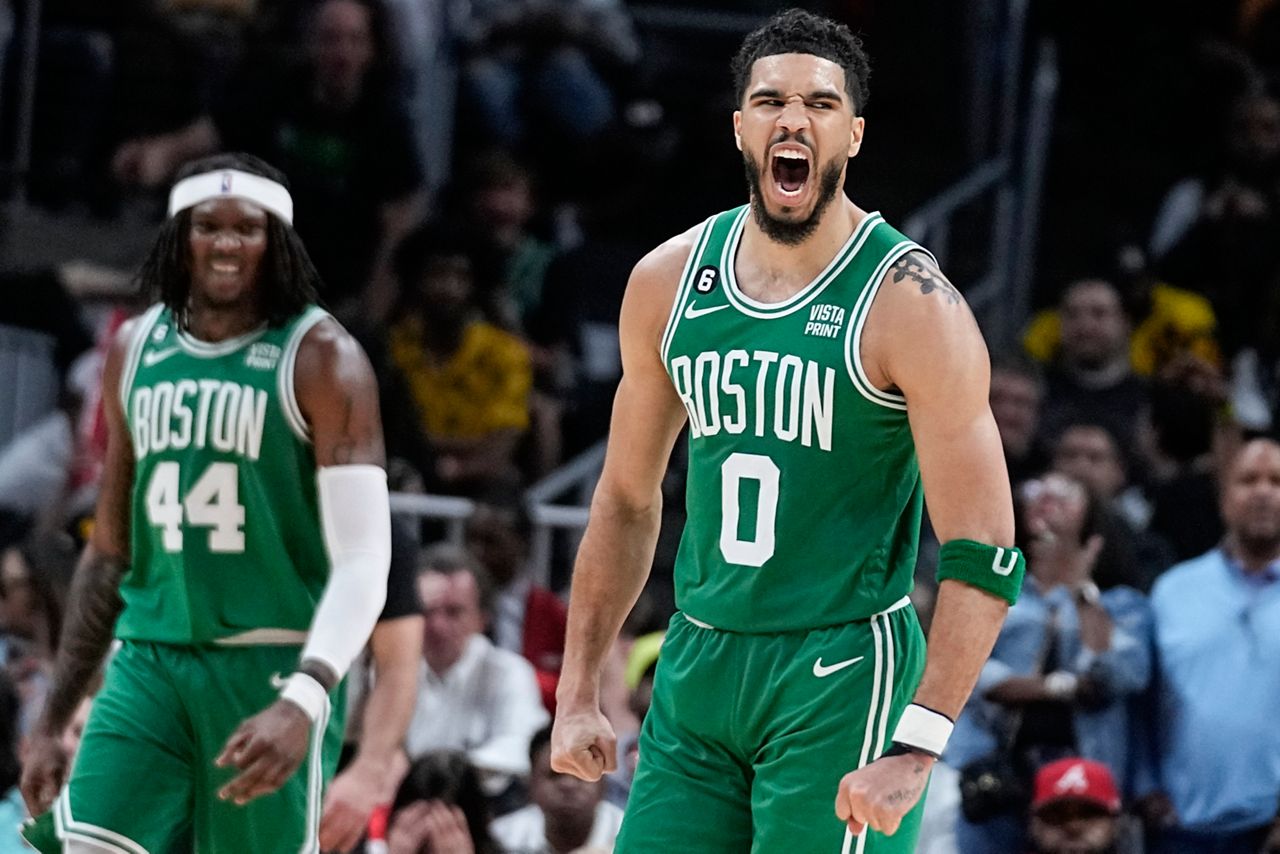 Boston Celtics forward Jayson Tatum (0) celebrates after scoring against the Atlanta Hawks during the second half of Game 4 of a first-round NBA basketball playoff series, Sunday, April 23, in Atlanta. (AP Photo/Brynn Anderson)