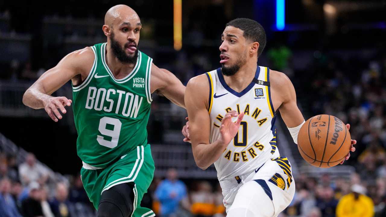 Indiana Pacers guard Tyrese Haliburton (0) drives on Boston Celtics guard Derrick White (9) during the first half of an NBA basketball game in Indianapolis, Monday, Jan. 8, 2024. Haliburton was injured on the play. (AP Photo/Michael Conroy)