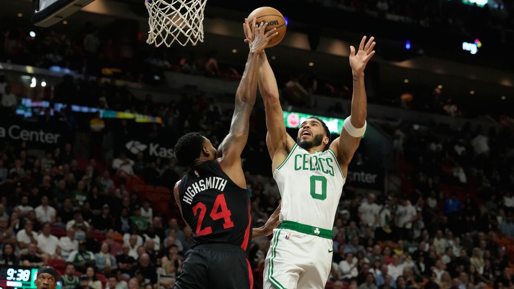 Boston Celtics forward Jayson Tatum (0) drives to the basket as Miami Heat forward Haywood Highsmith (24) defends during the first half of an NBA basketball game, Thursday, Jan. 25, 2024, in Miami. (AP Photo/Marta Lavandier)