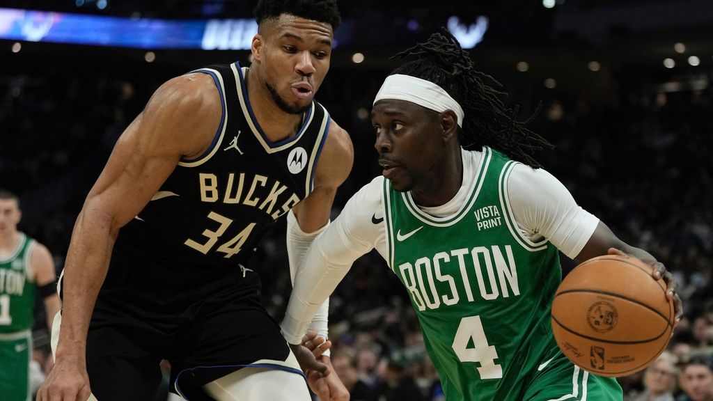 Boston Celtics' Jrue Holiday gets past Milwaukee Bucks' Giannis Antetokounmpo during the first half of an NBA basketball game Tuesday, April 9, 2024, in Milwaukee. (AP Photo/Morry Gash)