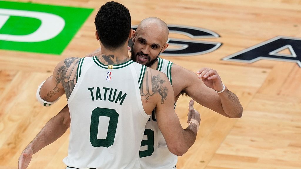 Boston Celtics forward Jayson Tatum (0) and guard Derrick White (9) celebrate after defeating the Indiana Pacers in overtime of Game 1 of the NBA Eastern Conference basketball finals, Tuesday, May 21, 2024, in Boston. (AP Photo/Michael Dwyer)
