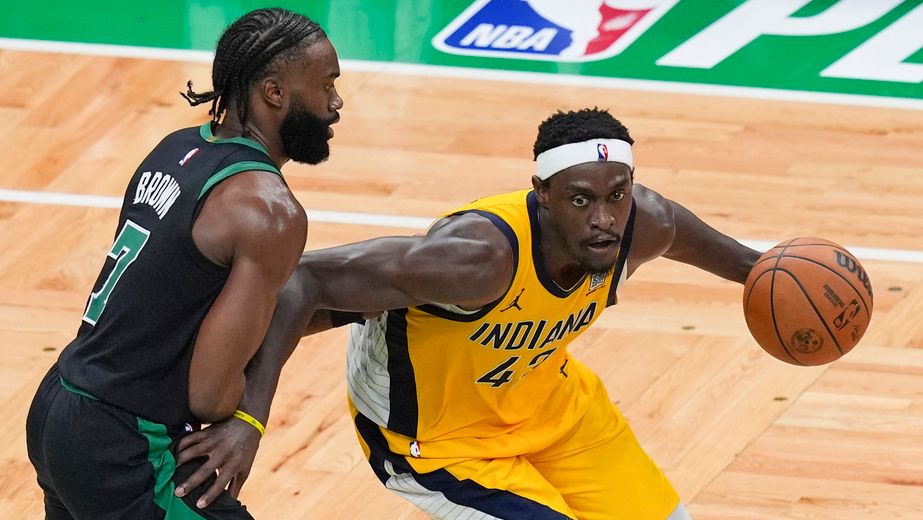 Indiana Pacers forward Pascal Siakam, right, is defended by Boston Celtics guard Jaylen Brown (7) during the second half of Game 2 of the NBA Eastern Conference basketball finals Thursday, May 23, 2024, in Boston. (AP Photo/Michael Dwyer)