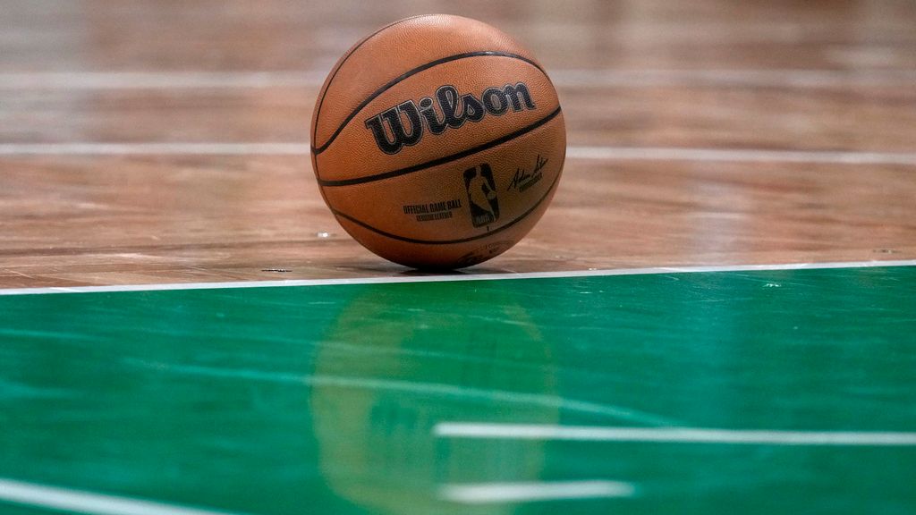 A basketball rests on the parquet floor of the TD Boston Garden during an NBA game, Wednesday, Jan. 10, in Boston. (AP Photo/Charles Krupa)