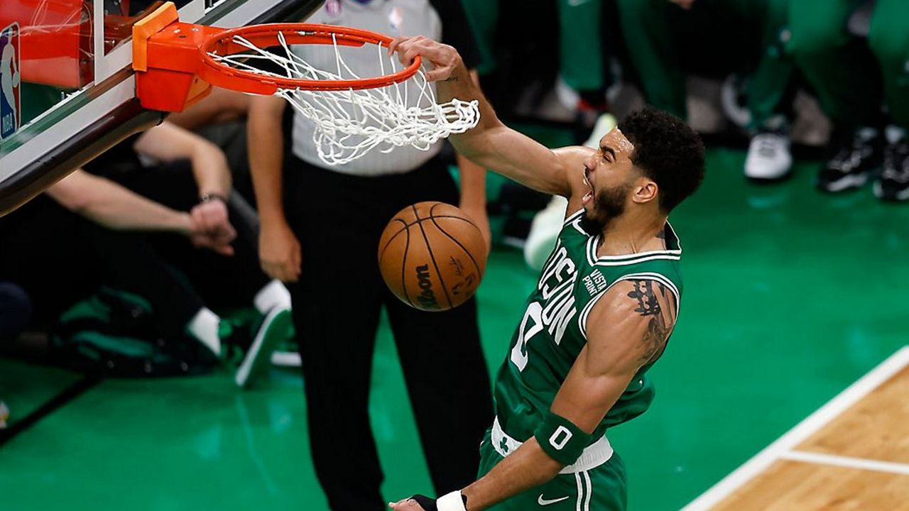 Boston Celtics forward Jayson Tatum dunks during the first half in Game 5 of the NBA basketball Eastern Conference finals against the Miami Heat Thursday, May 25, 2023, in Boston. (AP Photo/Michael Dwyer)