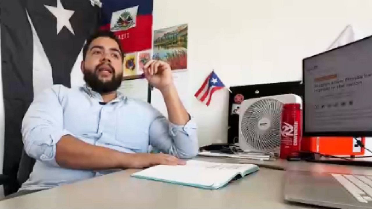Sam Delgado, programs manager for Central Florida Jobs With Justice, said that over 250,000 Orange County residents are struggling with healthcare debt after the COVID-19 pandemic. (Spectrum News)