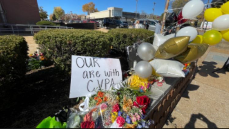 Growing memorial outside Central VPA after deadly shooting in St. Louis (Spectrum News/Gregg Palermo)