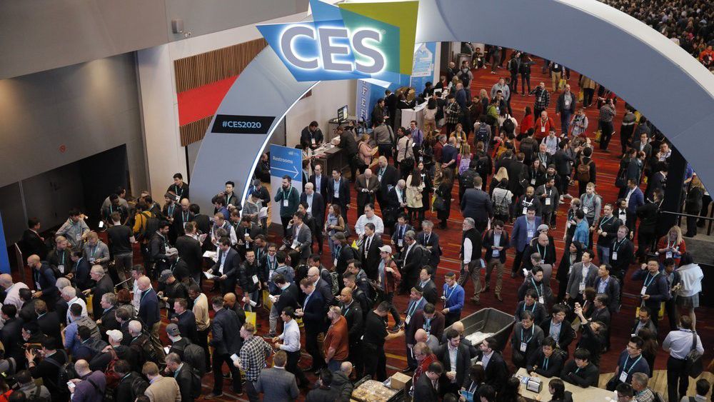 Crowds enter the convention center on the first day of the CES tech show, Tuesday, Jan. 7, 2020, in Las Vegas. (AP Photo/John Locher)