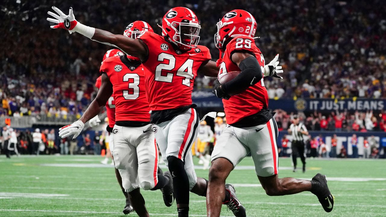 No. 1 Georgia will face No. 4 Ohio State in the Peach Bowl. (AP Photo/John Bazemore)