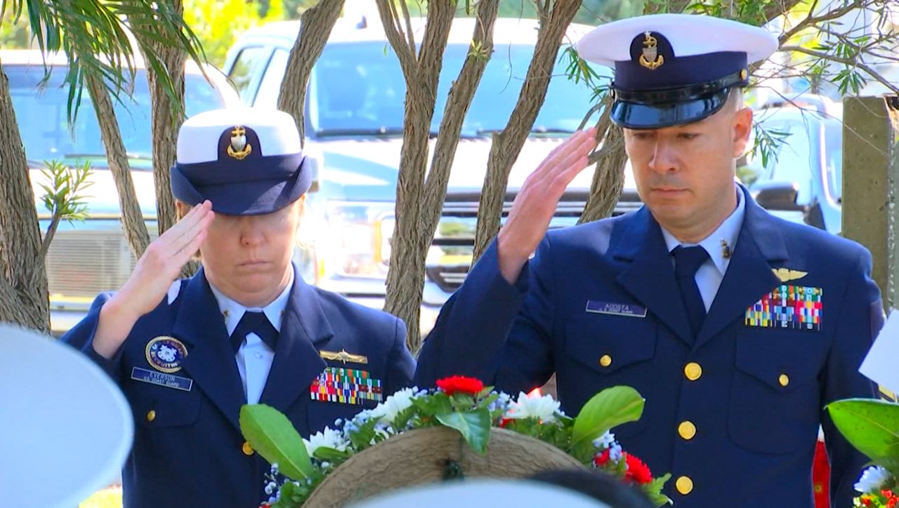 Coast Guard members pay their respects to fallen members of USCGC Blackthorn 40 years later. (Adria Iraheta/Spectrum Bay News 9)