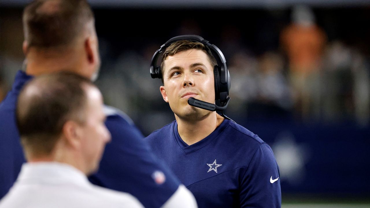 Dallas Cowboys offensive coordinator Kellen Moore walks along the sideline in the first half of a preseason NFL football game against the Seattle Seahawks in Arlington, Texas, Aug. 26, 2022.  (AP Photo/Ron Jenkins)