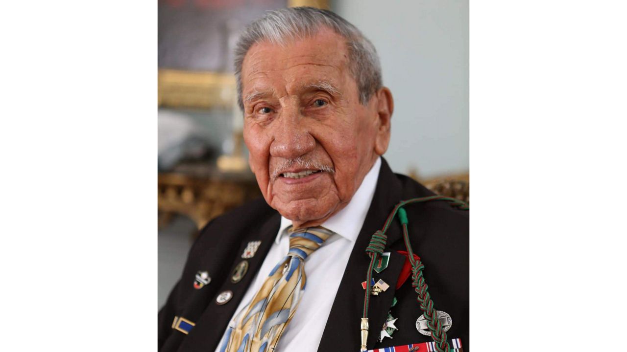 FILE — WWII veteran Charles Shay, pays tribute to soldiers during a D-Day commemoration ceremony of the 78th anniversary for those who helped end World War II, in Saint-Laurent-sur-Mer, Normandy, France, Monday, June 6, 2022. On D-Day, Charles Shay was a 19-year-old Native American army medic who was ready to give his life — and actually saved many. Now 99, he's spreading a message of peace with tireless dedication as he's about to take part in the 80th celebrations of the landings in Normandy that led to the liberation of France and Europe from Nazi Germany occupation. (AP Photo/ Jeremias Gonzalez, File)