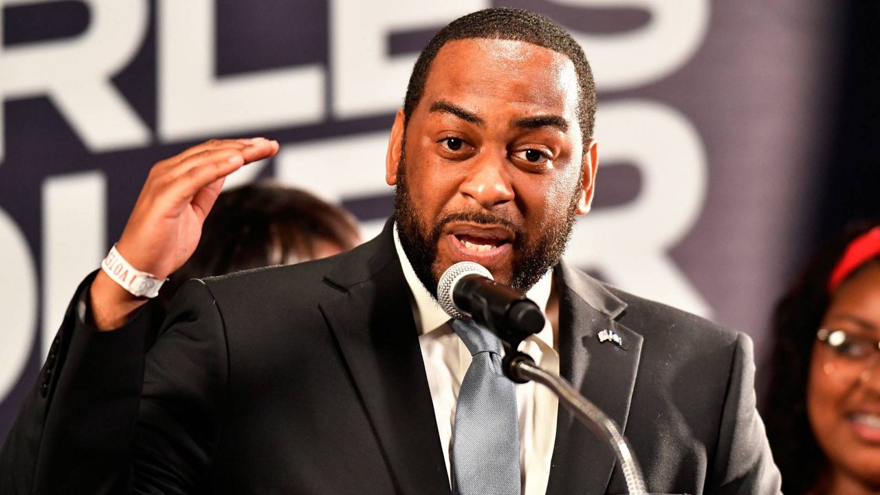 Democrat Charles Booker speaks to a group of supporters