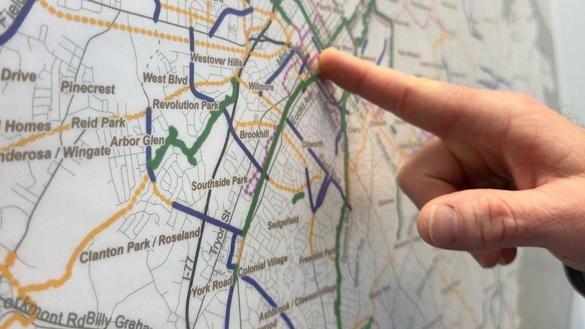 Eric Zaverl, an urban design specialist for Sustain Charlotte, points out bike paths in Charlotte. (Spectrum News 1/Jordan Kudisch)