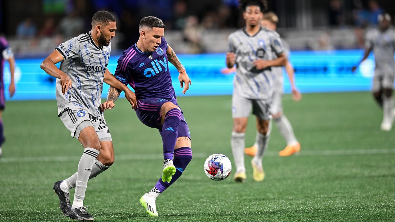 CF Montreal defender George Campbell, left, and Charlotte FC forward Enzo Copetti fight for the ball during an MLS soccer match on Saturday, June 24, 2023, in Charlotte, N.C. (AP Photo/Matt Kelley)