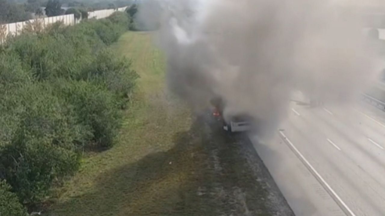 A charter bus carrying elementary school students caught fire and shut down I-95 on Wednesday. No one was injured, a Brevard Public Schools spokesperson said. (Florida Department of Transportation)