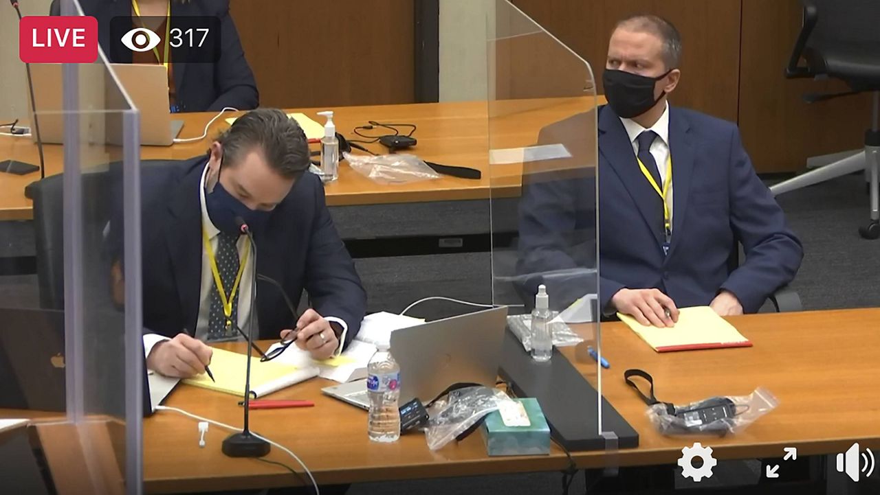 In this image taken from video, defense attorney Eric Nelson (left) and defendant Derek Chauvin listen as Hennepin County Judge Peter Cahill presides over a hearing before jury selection on Monday. (Court TV/Pool via AP) 