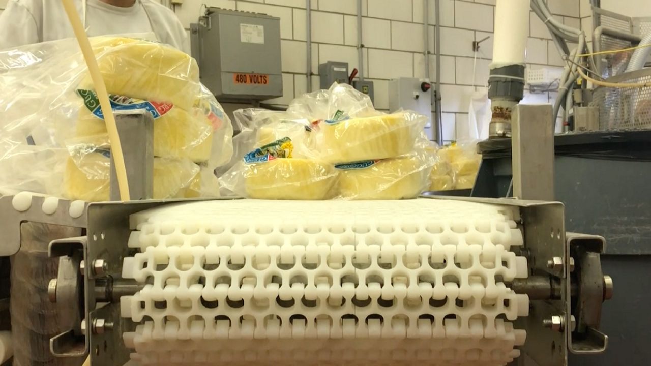 https://s7d2.scene7.com/is/image/TWCNews/cheese_making_png