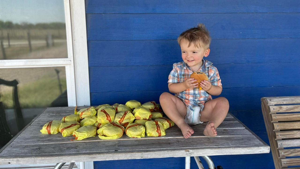 Barrett with his cheeseburgers. (Kelsey Golden's Facebook)