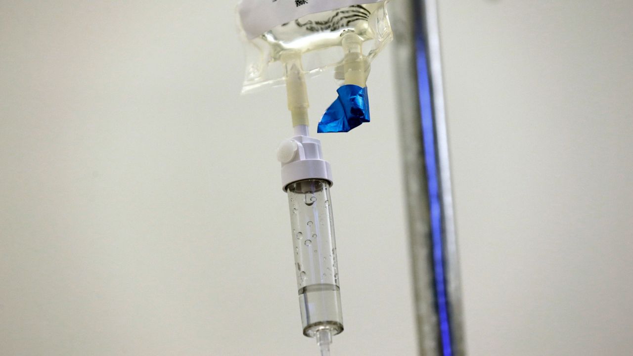Chemotherapy drugs are administered to a patient at a hospital in Chapel Hill, N.C. (AP Photo/Gerry Broome, File)