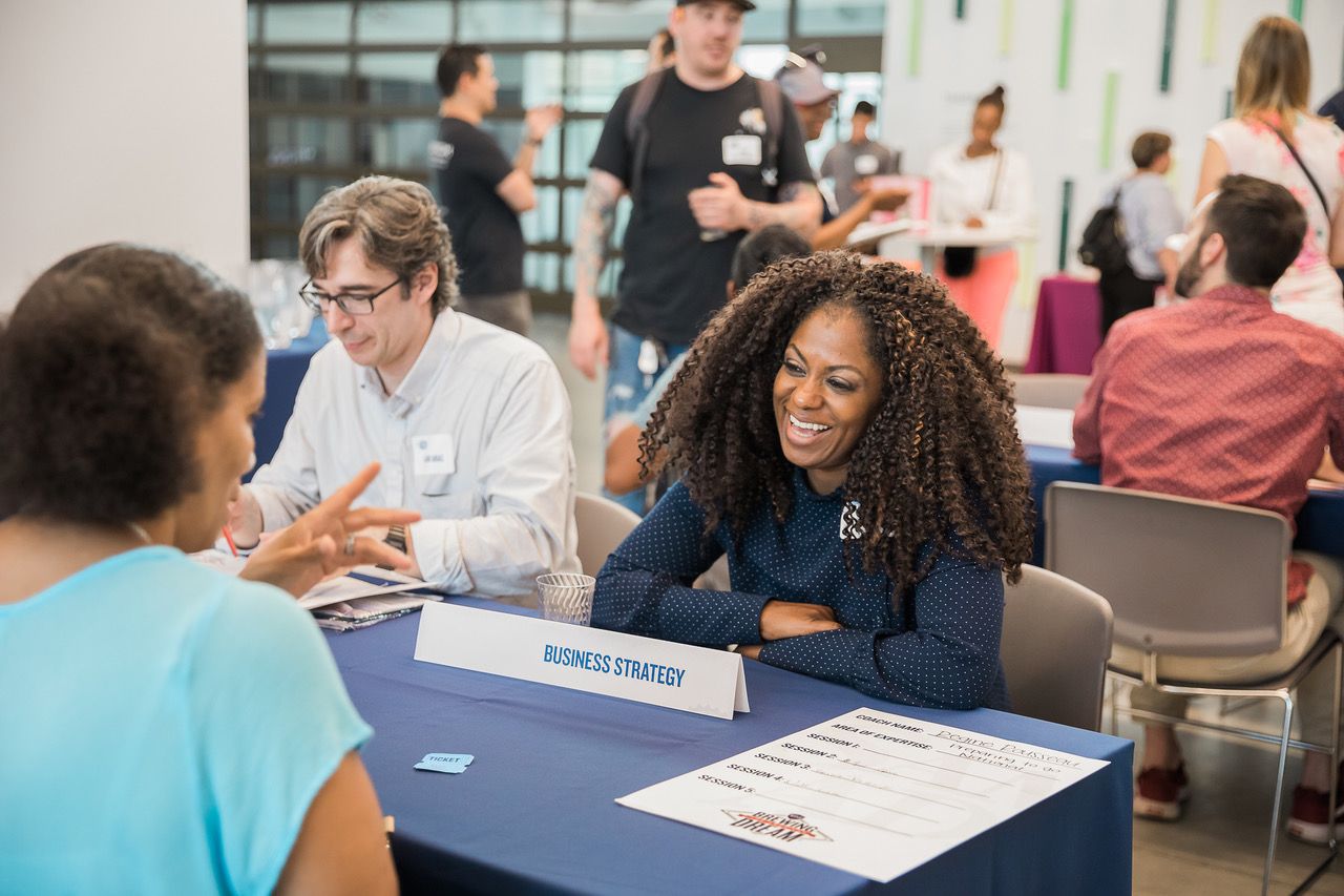 A business strategy professional talks to a brewer during a Samuel Adams event in Chicago. (Photo courtesy of Samuel Adams)