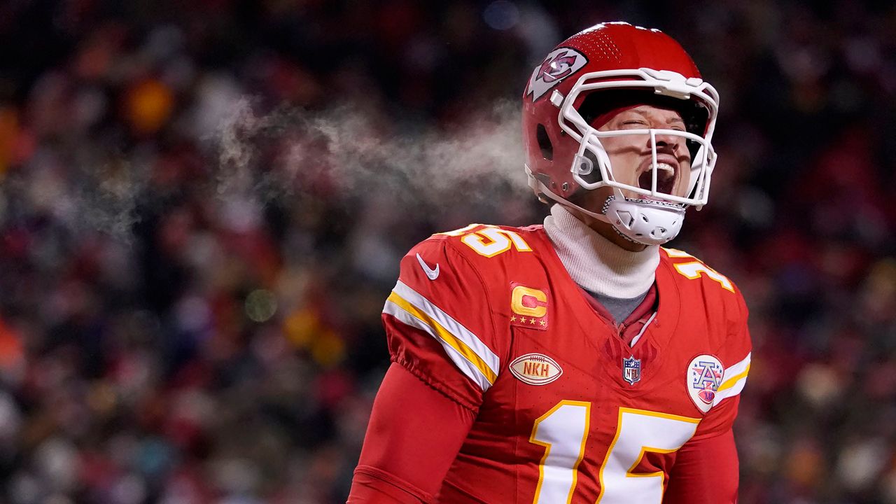 Kansas City Chiefs quarterback Patrick Mahomes (15) celebrates after throwing a touchdown pass during the first half of an NFL wild-card playoff football game against the Miami Dolphins Saturday, Jan. 13, 2024, in Kansas City, Mo. (AP Photo/Ed Zurga)