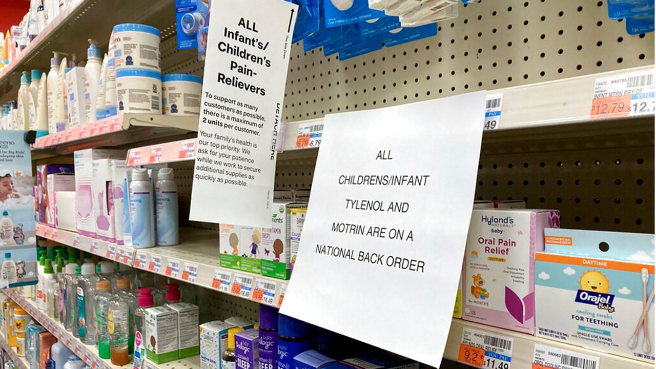 A sign is placed near the section for children's medicine, Sunday, Dec. 18, 2022 at a CVS in Greenlawn, N.Y. Caring for a sick child has become even more stressful than usual for many U.S. parents in recent weeks due to shortages of Children’s Tylenol and other medicines. (AP Photo/Leon Keith)