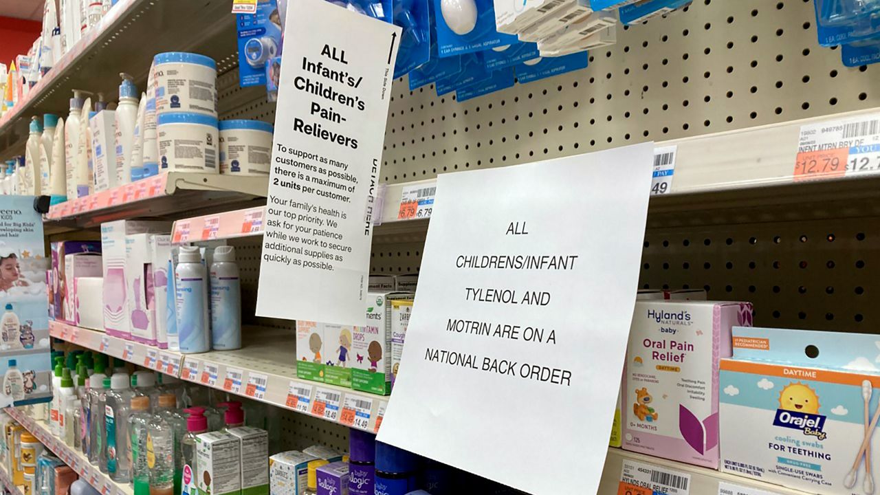 A sign is placed near the section for children's medicine Sunday at a CVS in Greenlawn, N.Y. (AP Photo/Leon Keith)