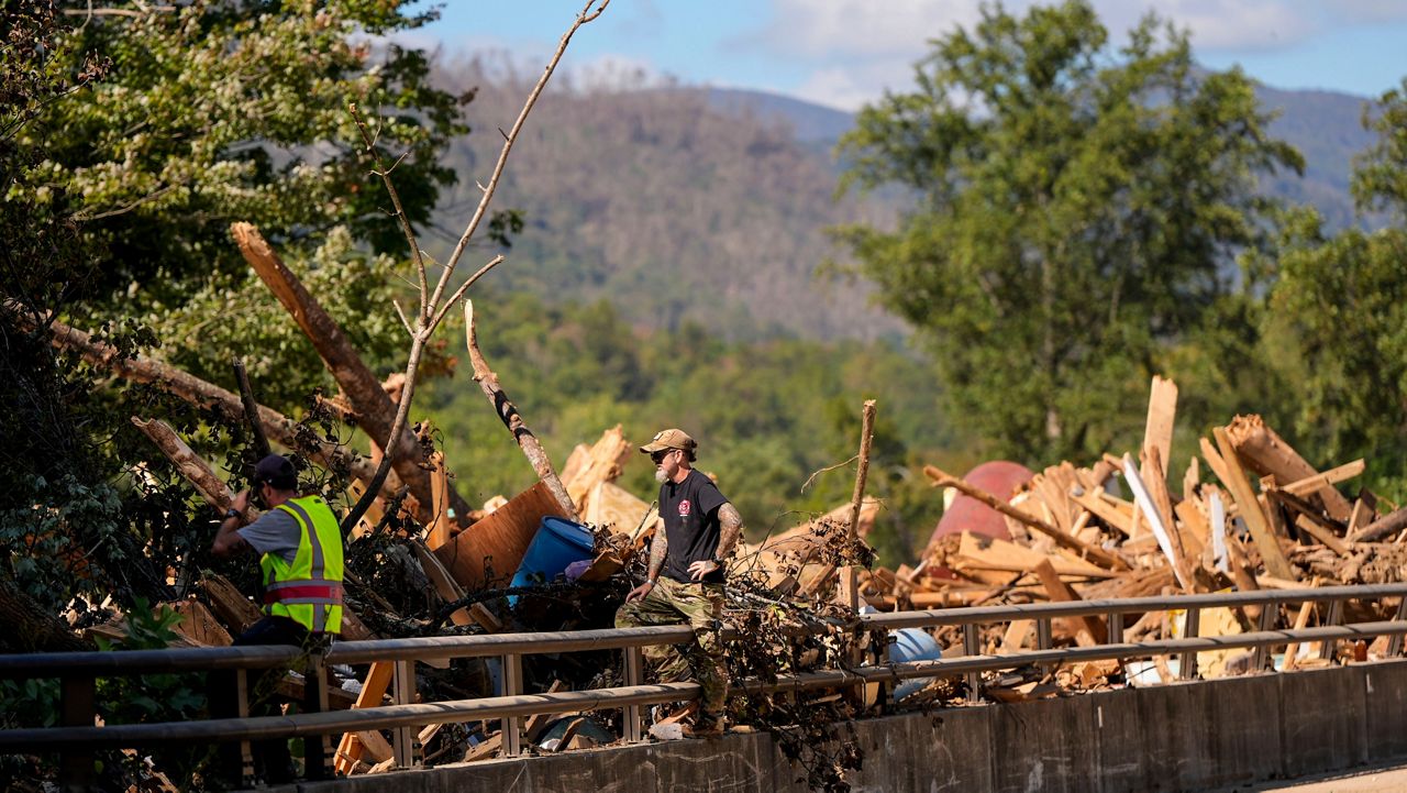 Debris rests on a bridge in the aftermath of Hurricane Helene on Wednesday, Oct. 2, 2024, in Chimney Rock Village, N.C. (AP Photo/Mike Stewart)