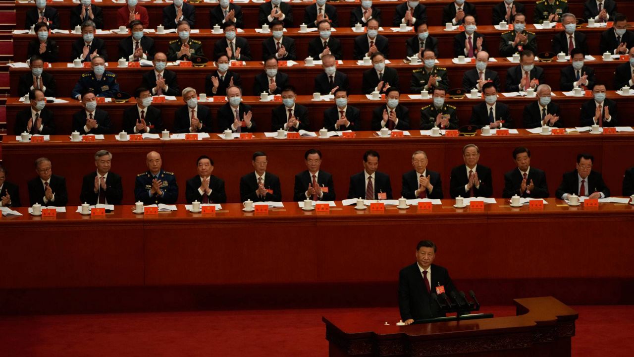 Delegates applaud as Chinese President Xi Jinping speaks during the opening ceremony of the 20th National Congress of China's ruling Communist Party held at the Great Hall of the People in Beijing, China, on Sunday. (AP Photo/Mark Schiefelbein)