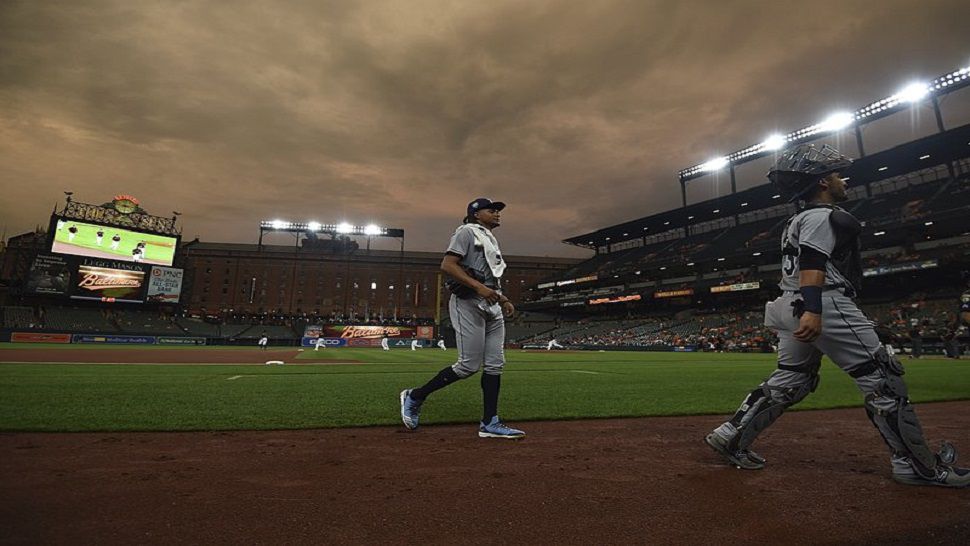 Tampa Bay Rays pitcher Chris Archer, left, walks into the dugout before starting against the Baltimore Orioles in a baseball game, Friday, July 27, 2018, in Baltimore. (AP Photo/Gail Burton)