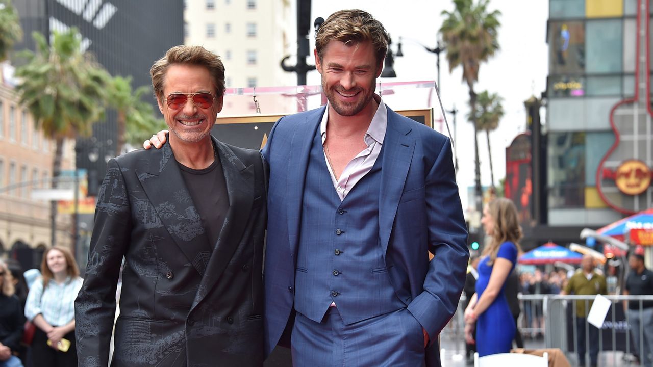 Robert Downey Jr., left, and Chris Hemsworth attend a ceremony honoring Hemsworth with a star on the Hollywood Walk of Fame on Thursday in Los Angeles. (Photo by Jordan Strauss/Invision/AP)