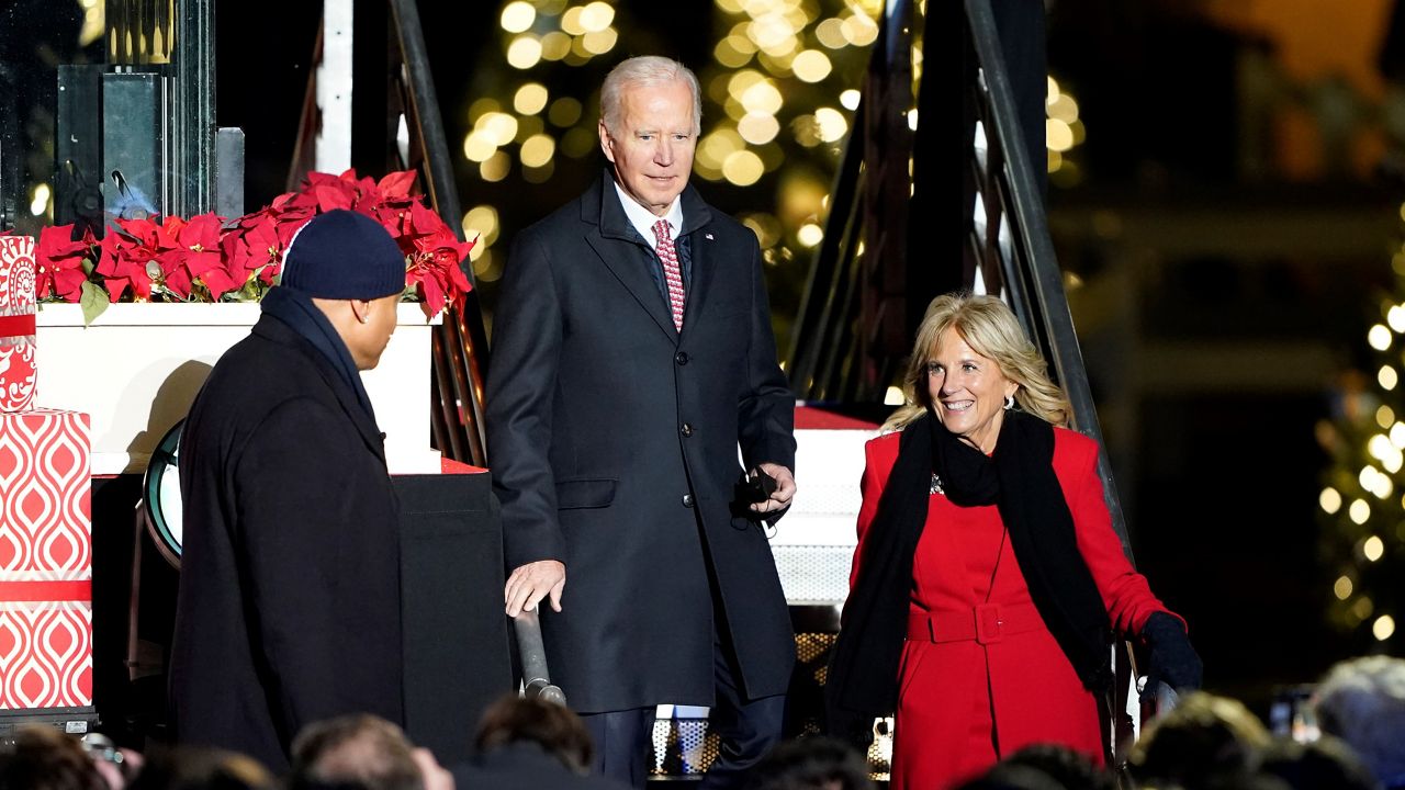 LL Cool J escorts President Joe Biden and first lady Jill Biden from the stage as they attend the National Christmas Tree lighting ceremony at the Ellipse near the White House, Thursday, Dec. 2, 2021, in Washington. (AP Photo/Andrew Harnik)