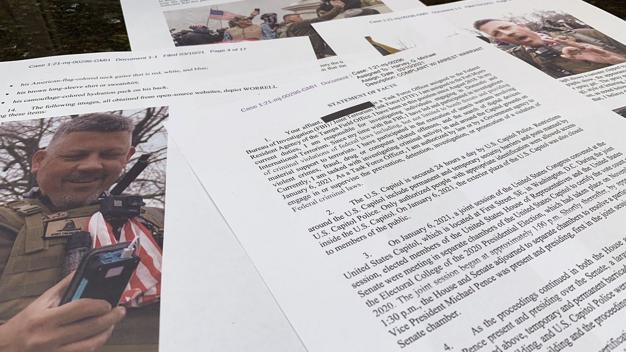 This photo shows part of the Justice Department's statement of facts in the complaint and arrest warrant for Christopher Worrell. (AP Photo/Jon Elswick, File)