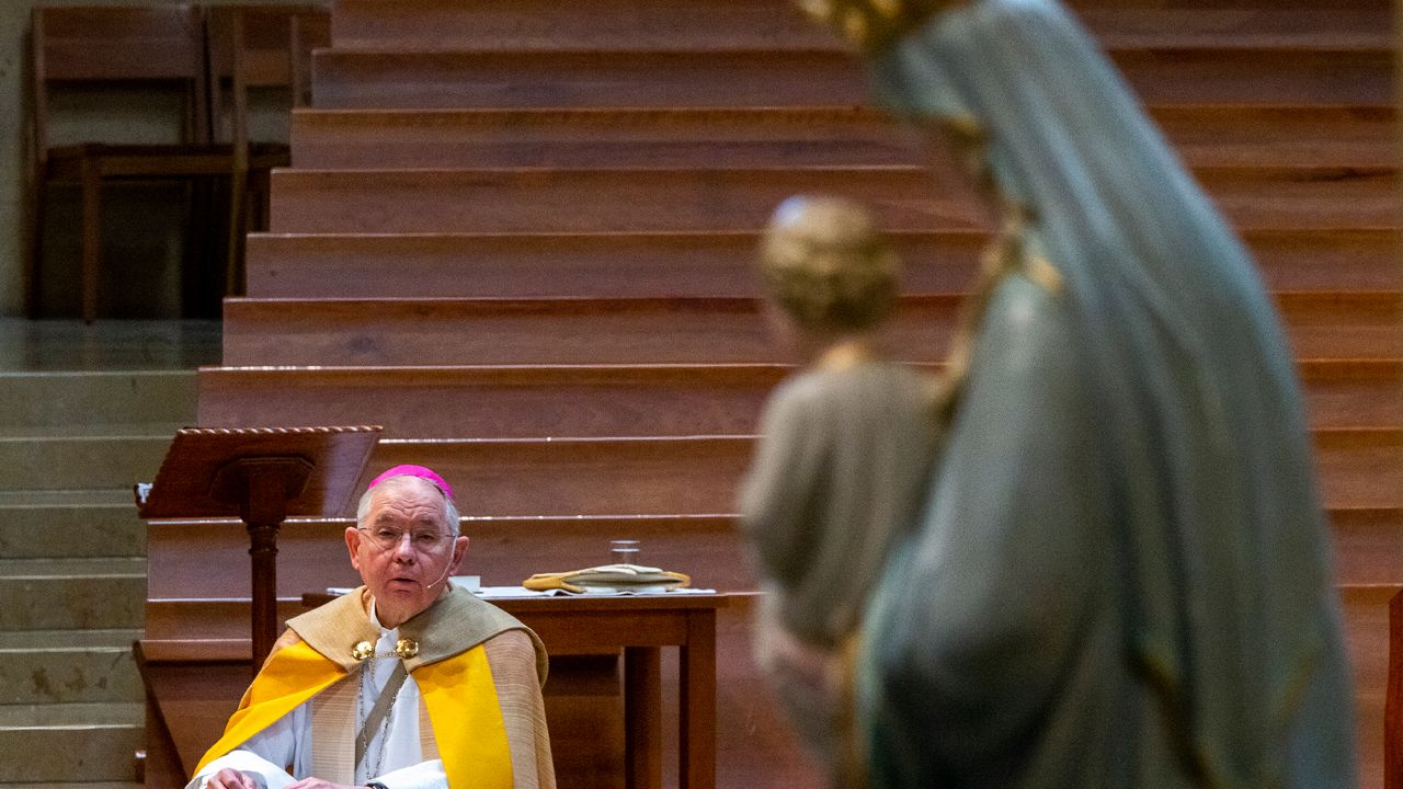 Archbishop Jose H. Gomez, of Los Angeles, and president of the U.S. Conference of Catholic Bishops (USCCB), kneels in prayer before a statue of the Blessed Virgin Mary, "Mother of the Church," as he leads a special liturgy in renewing the consecration of the United States to the care of our Blessed Mother amidst the COVID-19 pandemic at the Cathedral of Our Lady of the Angels in Los Angeles, Friday, May 1, 2020. As the world continues to face the ongoing effects of the global pandemic of the coronavirus, Archbishop Gomez with the U.S. bishops joined the Canadian Conference of Catholic Bishops on Friday in renewing the consecrations of the two nations to the care of our Blessed Mother. Without the ability to have public Mass and visitors due to the new coronavirus pandemic, the Cathedral of Our Lady of the Angels live-streams its services online on YouTube, Facebook and the web at lacatholics.org. (AP Photo/Damian Dovarganes, Pool)