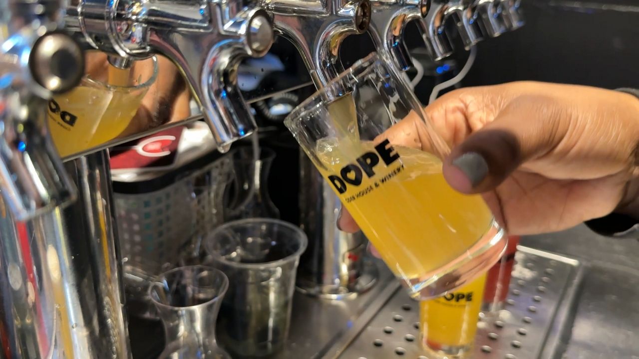 D.O.P.E. Cidery House and Winery owner Hannah Ferguson fills up a glass with her brewed cider