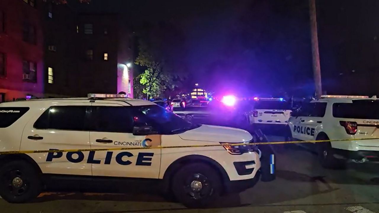 Cincinnati police respond to the area where a mass shooting took place Friday night in the city's west end. At least one person was killed, officials say. (Spectrum News 1/Jef Hitsman)