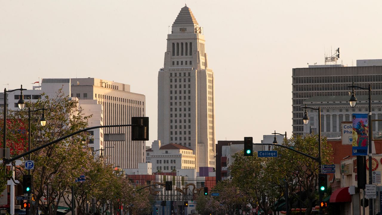 City Hall is seen from North Broadway and College in downtown Los Angeles on Thursday, April 2, 2020. California is in its second week of a statewide lockdown, where schools and nonessential businesses are closed and the governor has ordered people to stay home. (AP Photo/Damian Dovarganes)