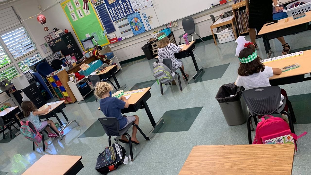 A classroom with children doing schoolwork. (AP)