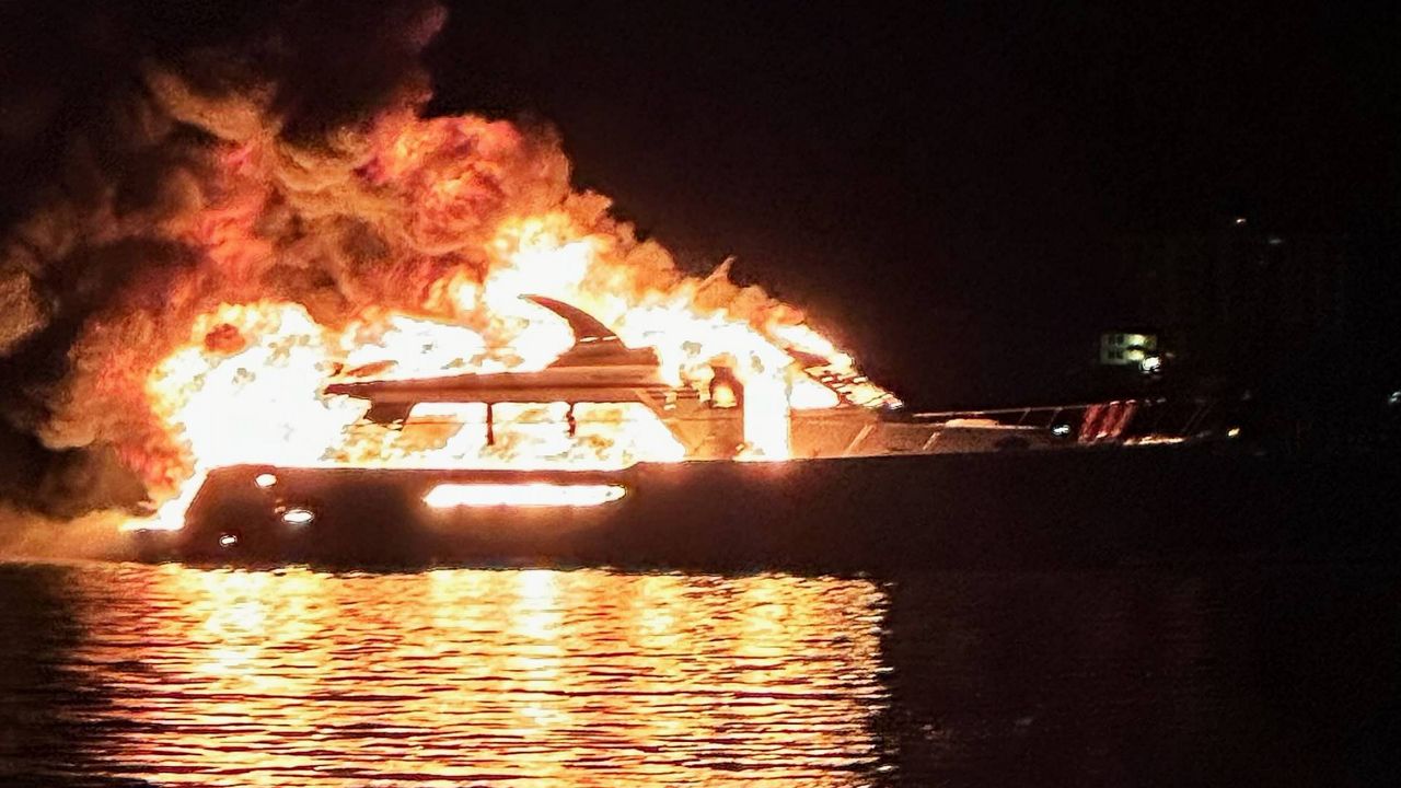 Two people were on the yacht when it caught fire on Coachman Park's waterfront. Officials said they were rescued with no injuries. (Photo Courtesy: Rob Shaw)