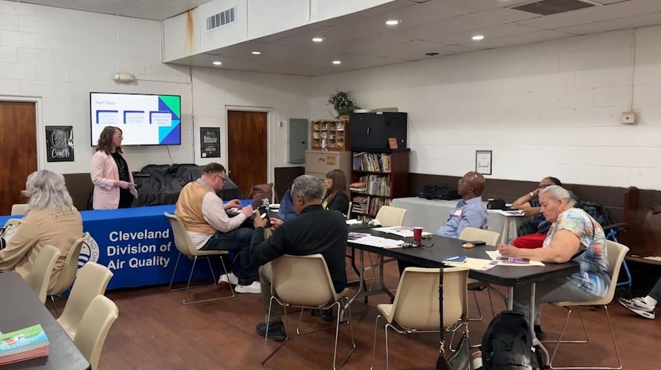 Cleveland’s chief of air pollution outreach Christina Yoka speaks to residents at a community meeting about the proposed updates to the city’s air pollution ordinances. (Spectrum News 1/Nora McKeown)