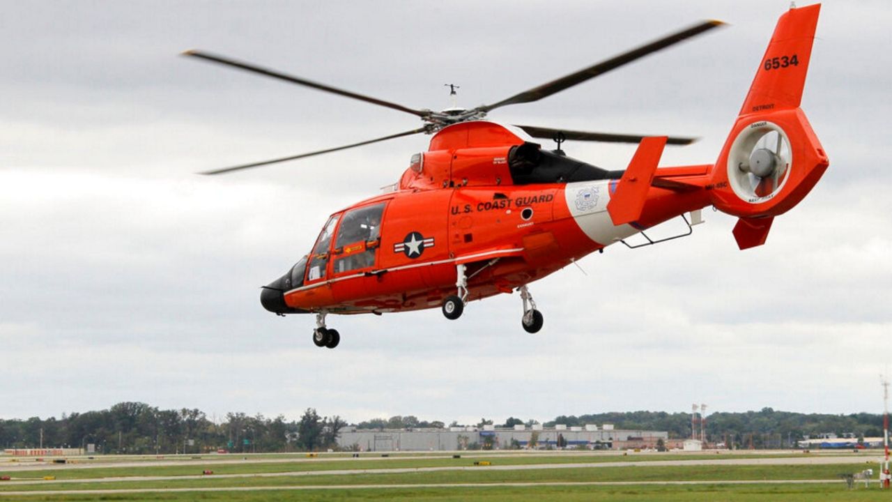 A Coast Guard helicopter was among the units that attempted to rescue three boaters in Lake Erie on Wednesday. Photo/Associated Press