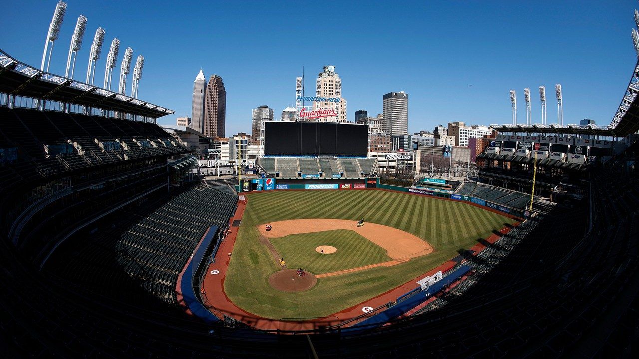 Workers finish installing the Cleveland Guardians sign above the scoreboard at Progressive Field, Thursday, March 17, 2022, in Cleveland. (AP Photo/Ron Schwane, File)