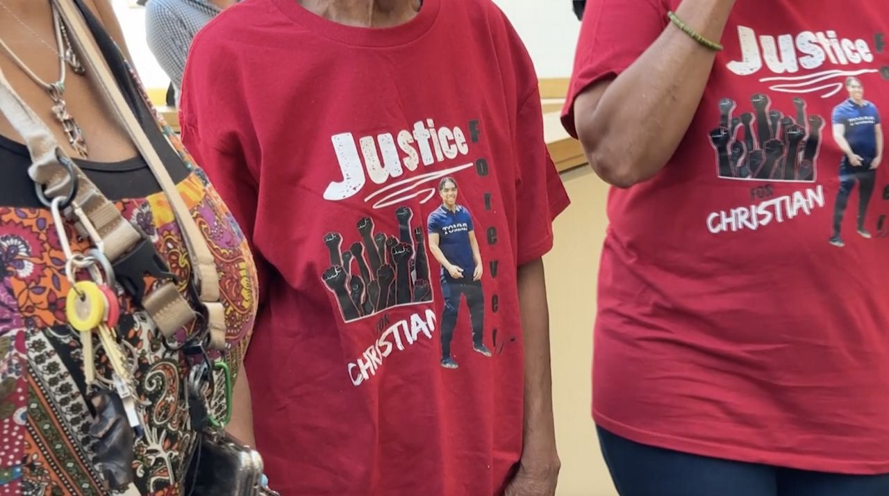 Family members of Christian Tyson Thomas appear at press conference after grand jury decides not issue criminal charges in fatal shooting of the 18-year old. (Spectrum News/Kimberly Perez)